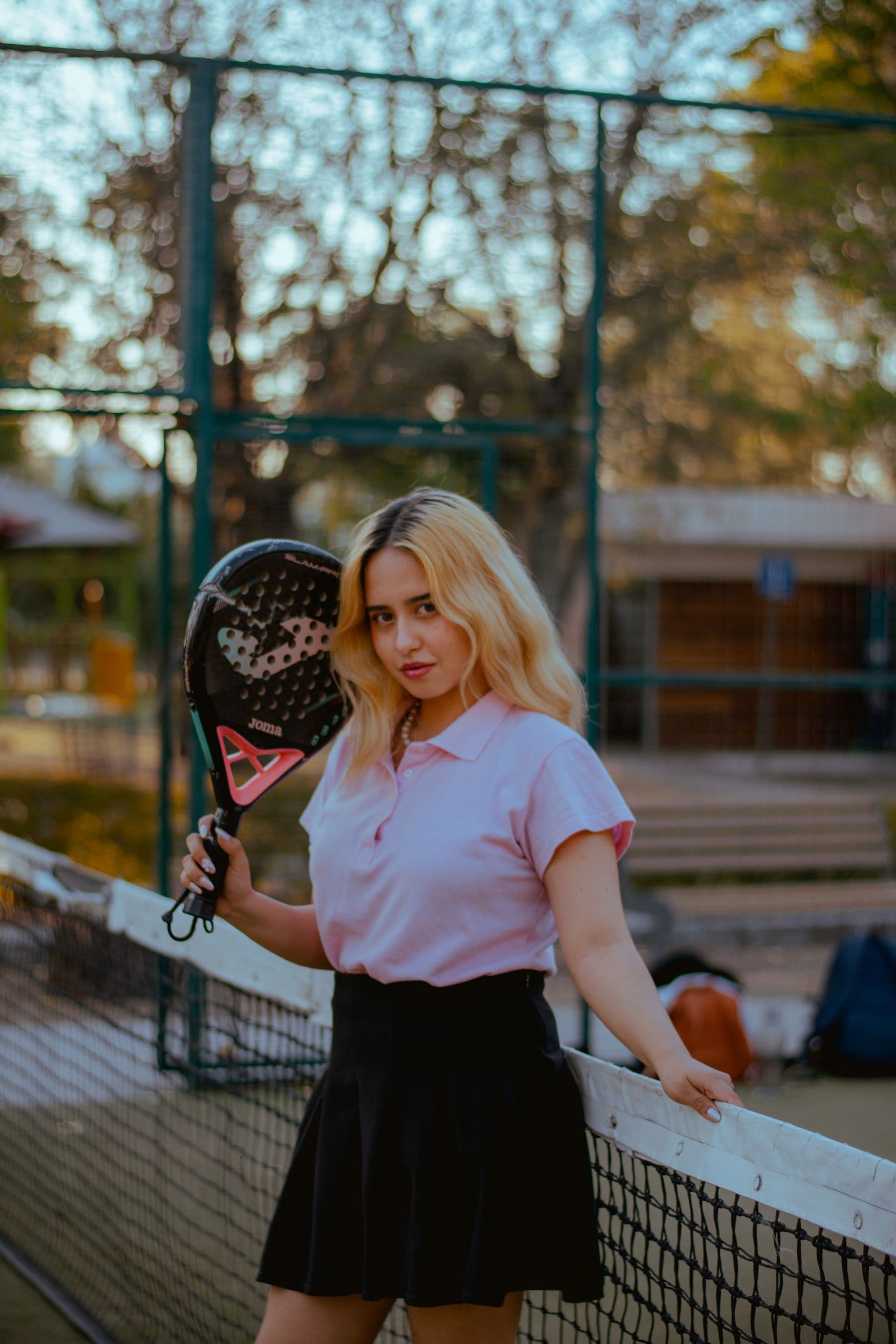 Athlete holding a racket on a sunny outdoor court
